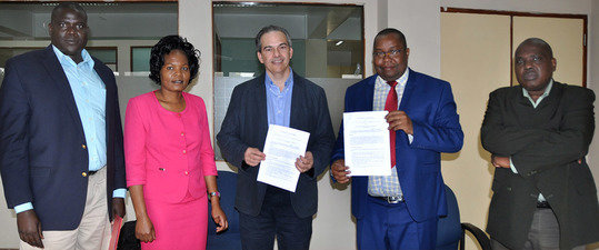Prof. Michael Petraglia and colleagues from the National Museums of Kenya, including Director General Dr. Mzalendo Kibunjia, at the MOU signing.