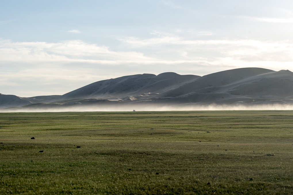 The sand dunes of Mongol Els jutting out of the steppe in Mongolia. Many of these desert barriers only appeared after the Last Glacial Maximum (~20,000 years ago).