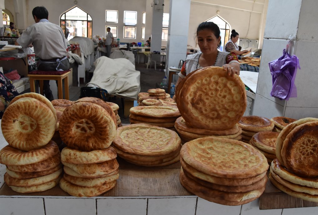 Bread was central to most ancient cuisines of West Asia, as evidenced by remains of ancient grains and grinding stones in archaeological sites. Bread is still important in Central Asia today and each region has its own variety. In this photo a woman is selling bread at the bazaar in Bukhara. Photo taken by Dr. Spengler in 2017.