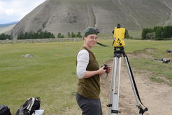Ulrike Thuering working with an electronic Total Station as part of Department of Archaeology fieldwork in Mongolia.