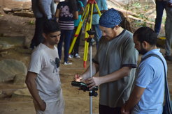 James Blinkhorn instructing Sri Lankan colleagues in the use of an electronic Total Station as part of Department of Archaeology fieldwork at Rajagala, Sri Lanka.