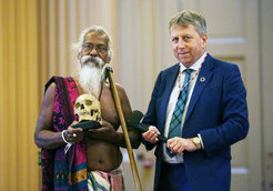 Chief Uruwarige holding Wanniyalaeto ancestral remains during the ceremony alongside the Principal of Edinburgh University who is holding gifts given by the Wanniyalaeto.