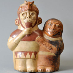 A ceramic figurine from the Moche culture of the north coast of Peru, depicting a human figure playing the panpipe.