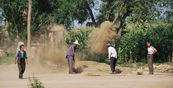 Farmers from near Hohhot, Inner Mongolia, China, winnowing crops after the harvest; photo taken by Spengler in 2010.