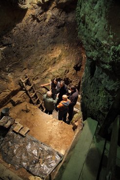 Douka and a team of colleagues inside Denisova Cave.